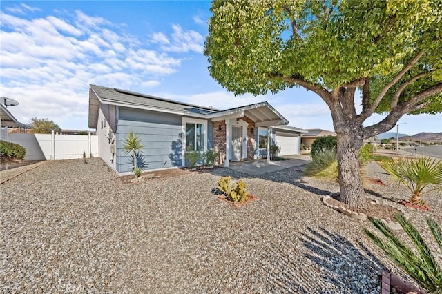 ranch-style home with a garage