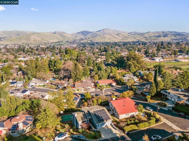 birds eye view of property featuring a mountain view