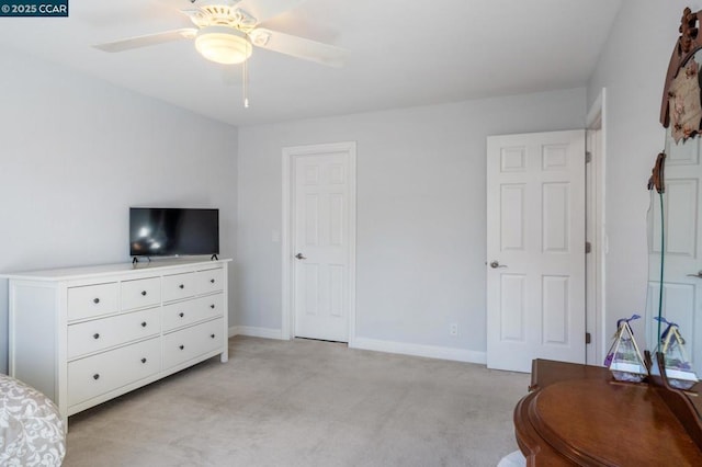 bedroom with ceiling fan and light carpet