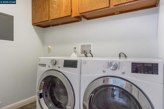 washroom featuring electric panel, cabinets, and independent washer and dryer