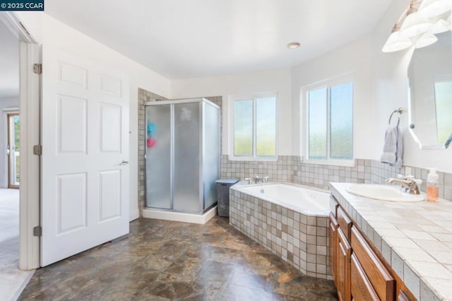 bathroom with separate shower and tub and vanity