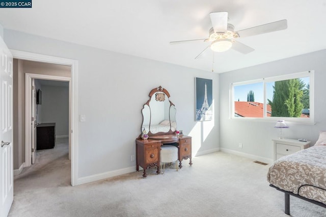 bedroom with light colored carpet and ceiling fan