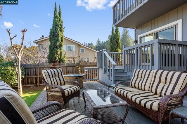 wooden deck featuring an outdoor living space