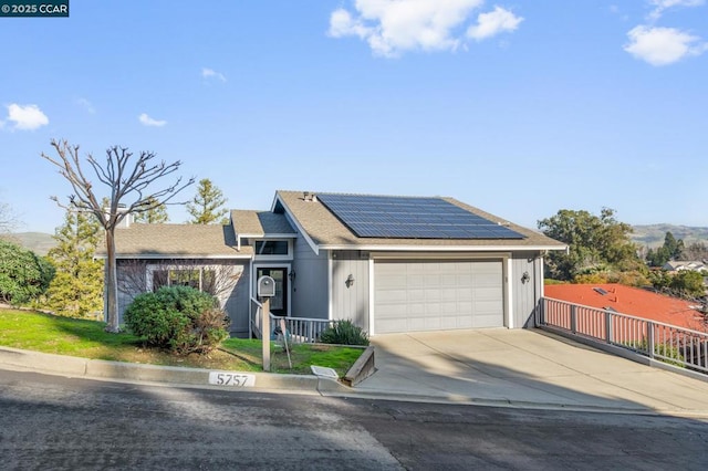 view of front of home featuring solar panels