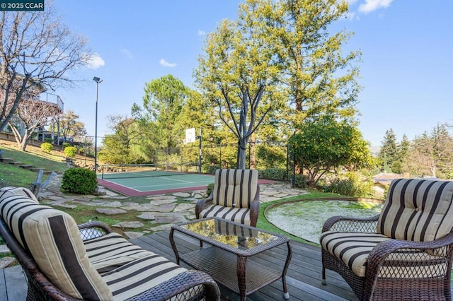 deck featuring tennis court