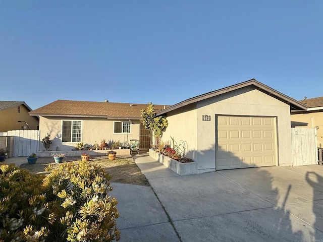 ranch-style home featuring a garage