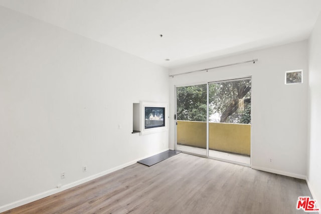 empty room with wood-type flooring