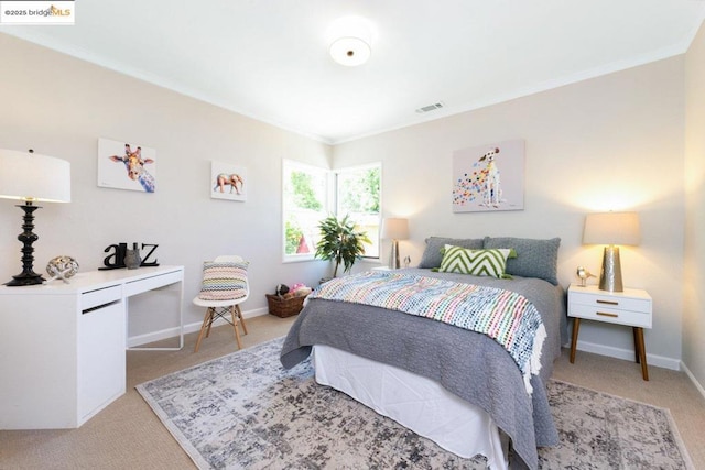 carpeted bedroom featuring ornamental molding