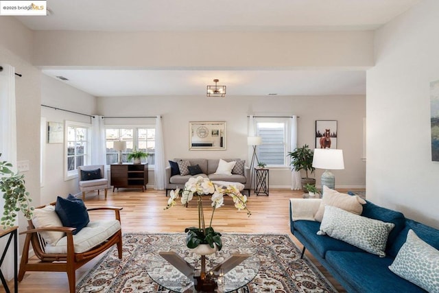 living room with light hardwood / wood-style flooring