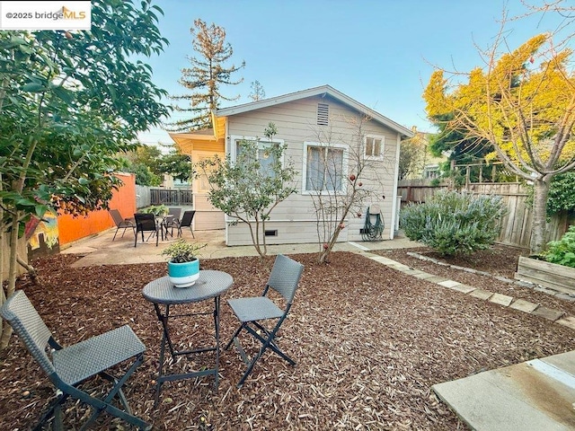 rear view of property featuring a patio