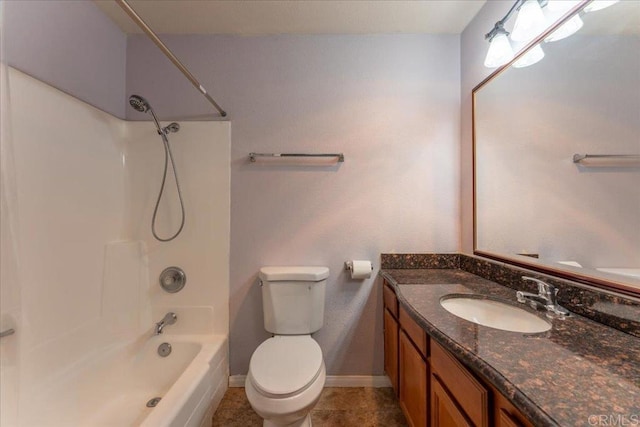 full bathroom featuring toilet, vanity, tile patterned flooring, and shower / bathtub combination