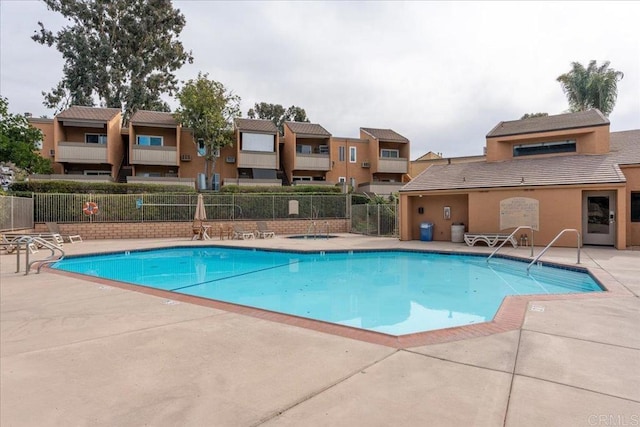 view of swimming pool with a patio area