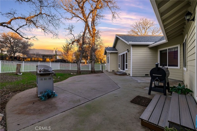 patio terrace at dusk with grilling area