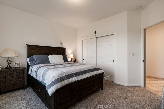 carpeted bedroom with a closet