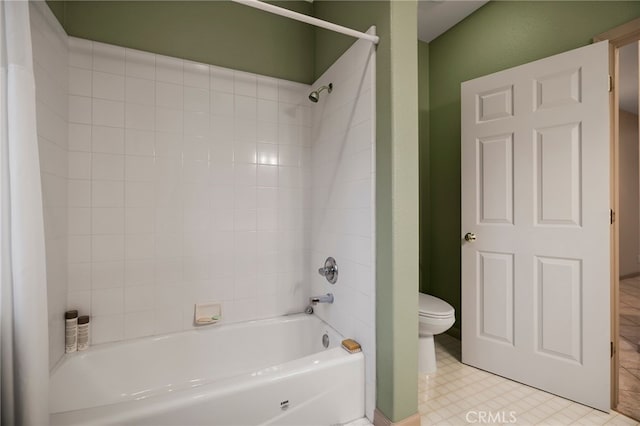 bathroom with toilet and shower / bathing tub combination