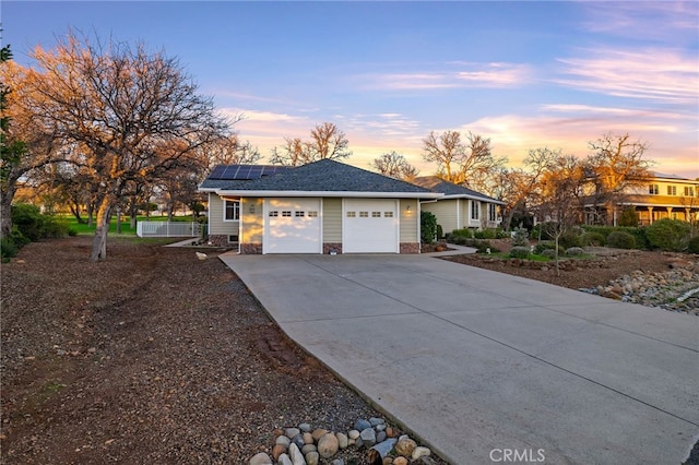 view of front of property featuring solar panels