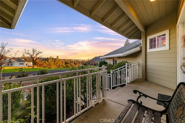 view of balcony at dusk