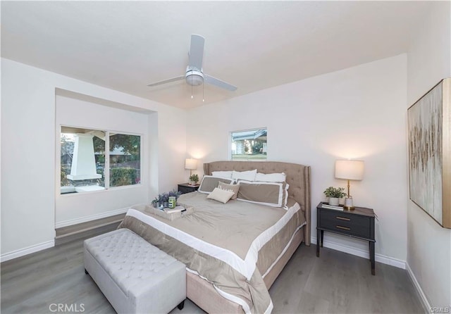 bedroom featuring ceiling fan and hardwood / wood-style flooring