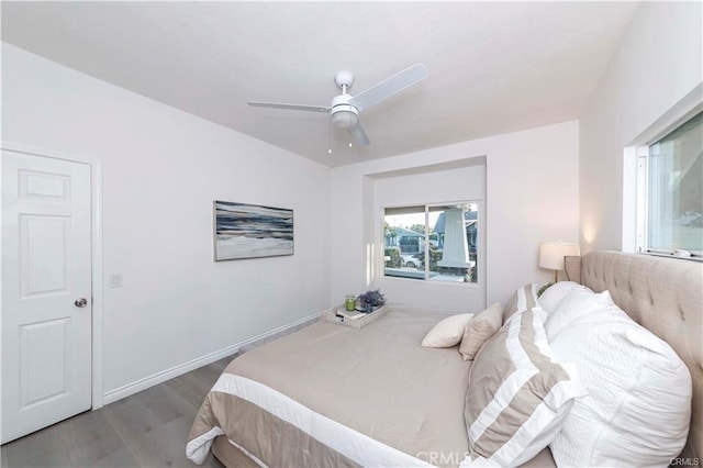 bedroom featuring ceiling fan and hardwood / wood-style floors