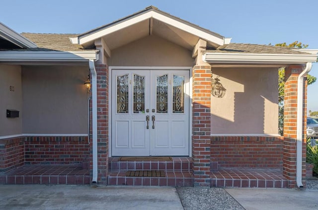 property entrance featuring french doors