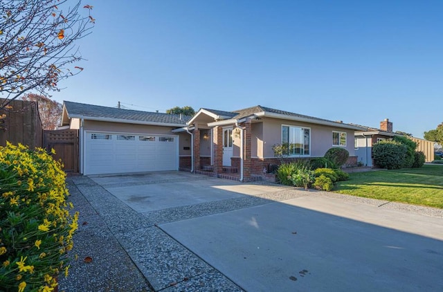 ranch-style home featuring a front yard and a garage