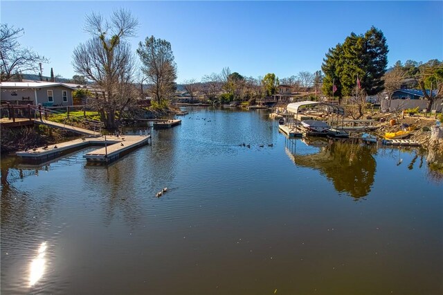 view of water feature with a dock