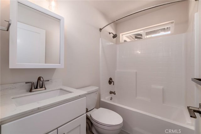 full bath featuring bathing tub / shower combination, vanity, and toilet