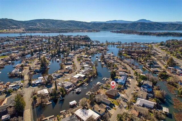 bird's eye view featuring a water and mountain view