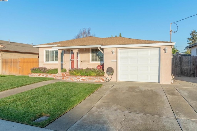 ranch-style home featuring a garage and a front lawn