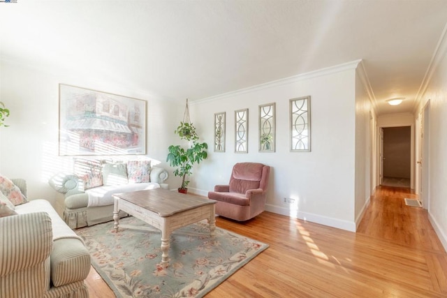 living room featuring ornamental molding and wood-type flooring