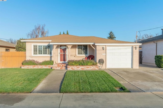 ranch-style home with a front yard and a garage