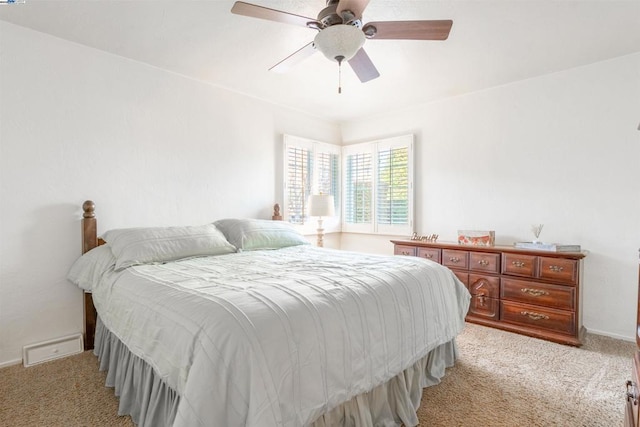 bedroom featuring ceiling fan and light carpet