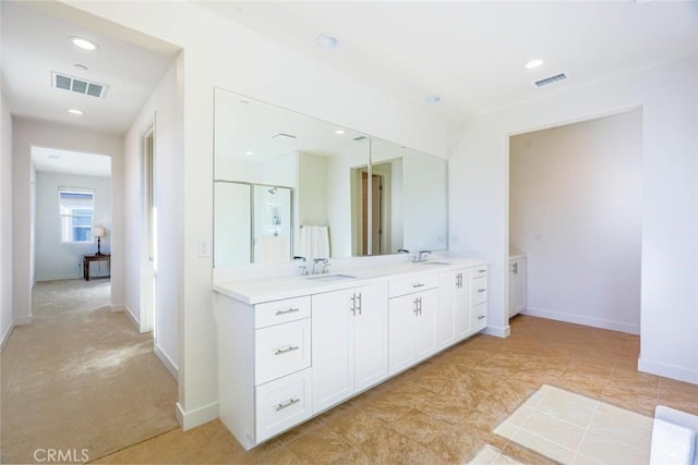 full bath with vanity, baseboards, recessed lighting, and visible vents