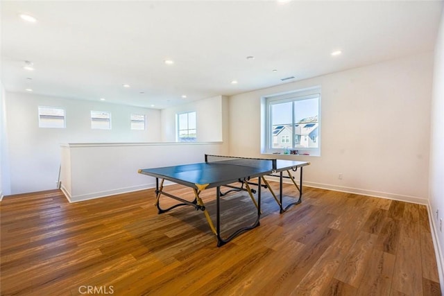 playroom featuring recessed lighting, wood finished floors, and a wealth of natural light