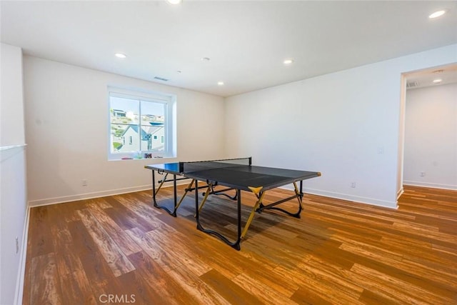 rec room featuring baseboards, recessed lighting, and wood finished floors