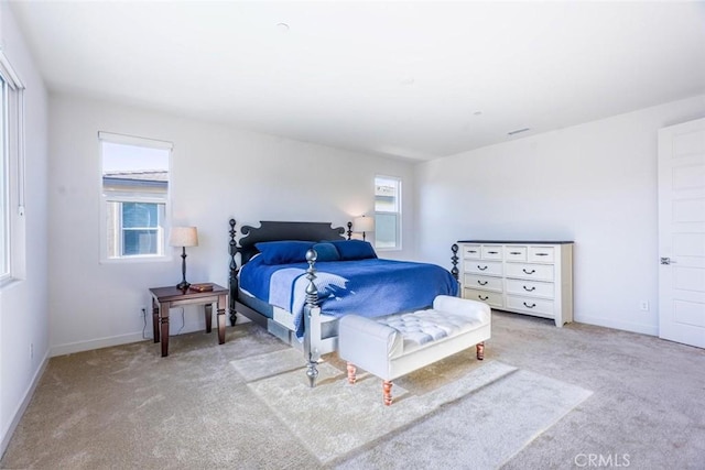 carpeted bedroom featuring baseboards