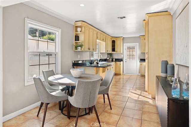 dining area featuring light tile patterned flooring, visible vents, and plenty of natural light