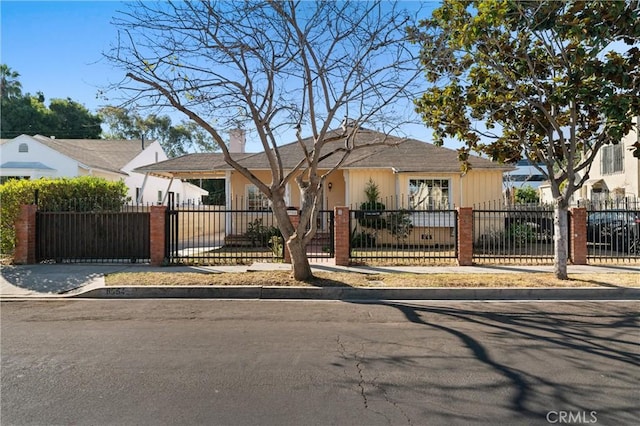 view of front of property featuring a gate and a fenced front yard