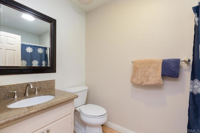 bathroom with toilet and vanity