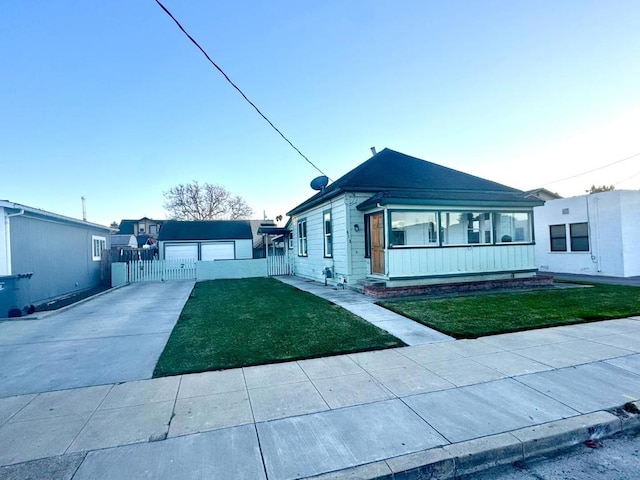 view of front facade with a garage and a front lawn