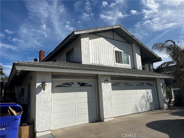 view of side of home with a garage