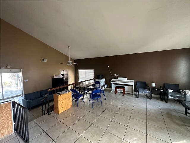 interior space with a balcony and ceiling fan