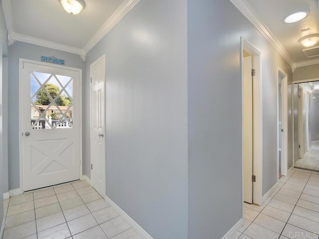 foyer entrance featuring crown molding and light tile patterned floors