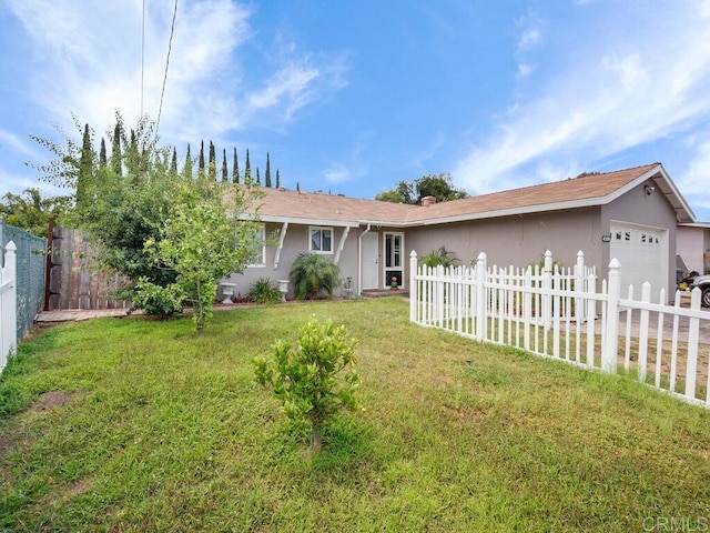 single story home with a front yard and a garage