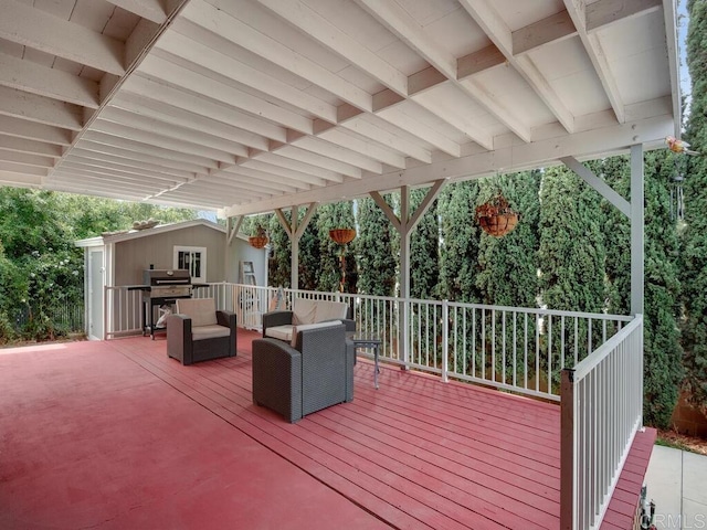 wooden terrace featuring a grill and outdoor lounge area