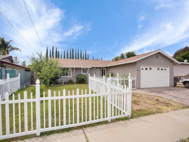 ranch-style house featuring a front lawn and a garage