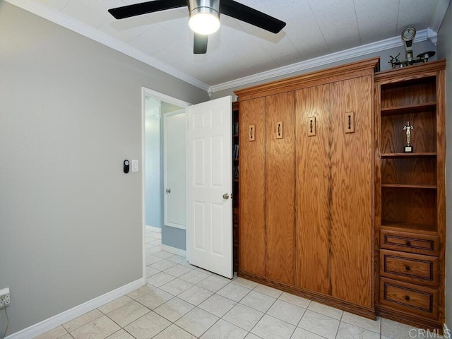 interior space featuring ornamental molding and ceiling fan