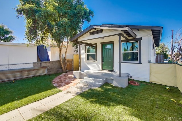 bungalow with a front yard