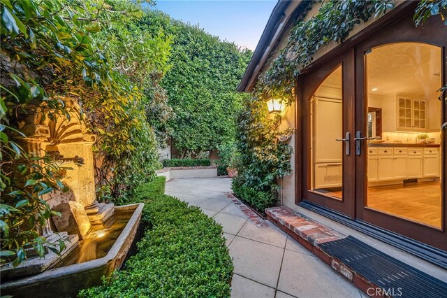 view of yard with french doors