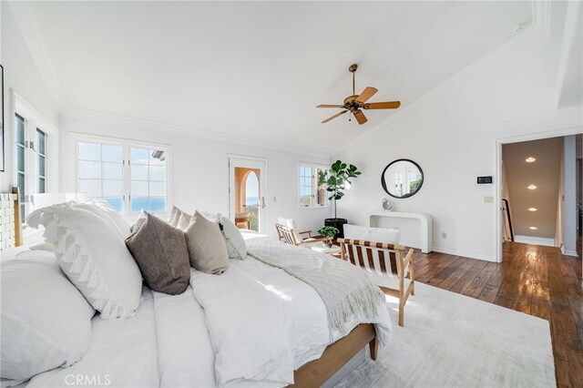 bedroom with crown molding, ceiling fan, dark hardwood / wood-style floors, and vaulted ceiling